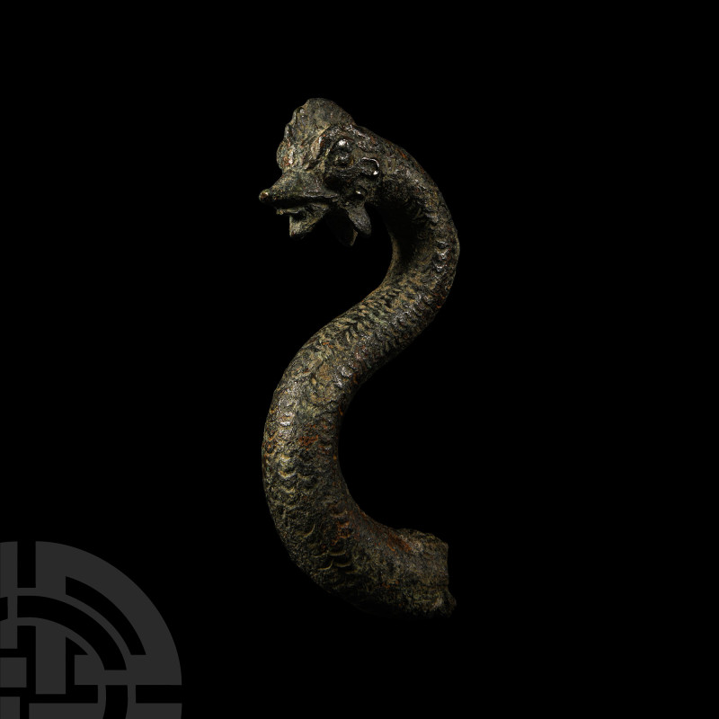Large Roman Bronze Basilisk
4th century A.D. The upper body, neck and head of a...