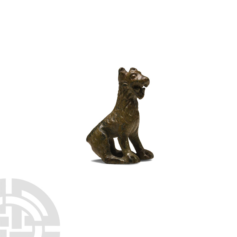 Roman Bronze Sitting Dog
1st-4th century A.D. Modelled seated on its rump with ...