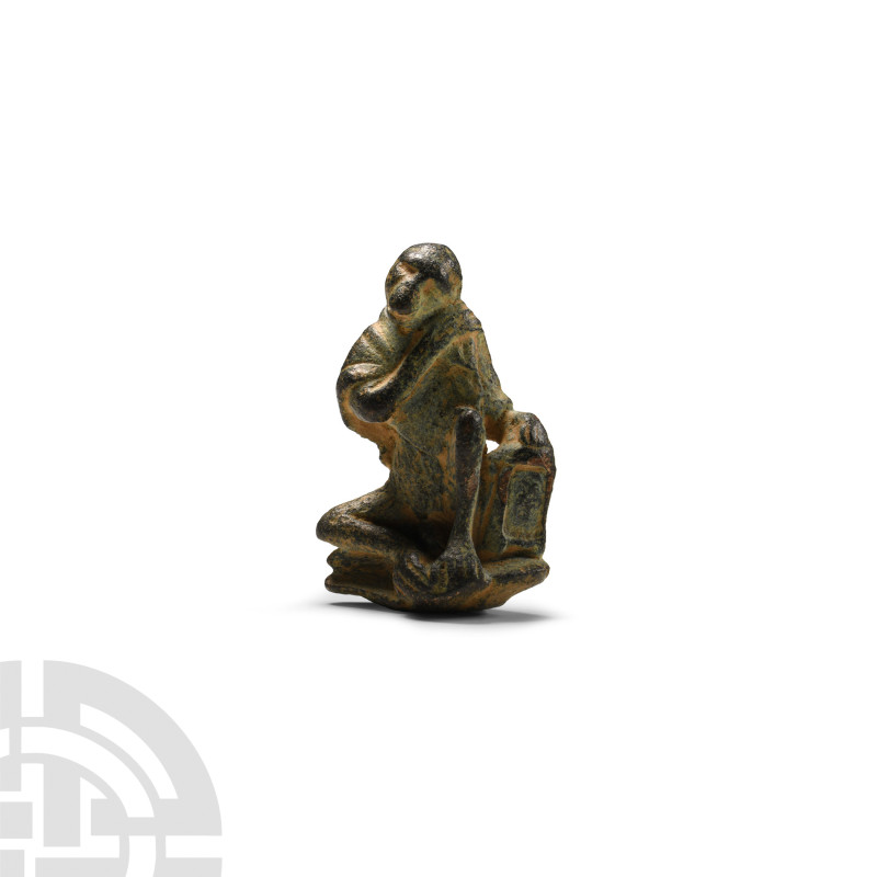Roman Bronze Military Monkey
4th century A.D. Modelled seated on a polygonal ba...