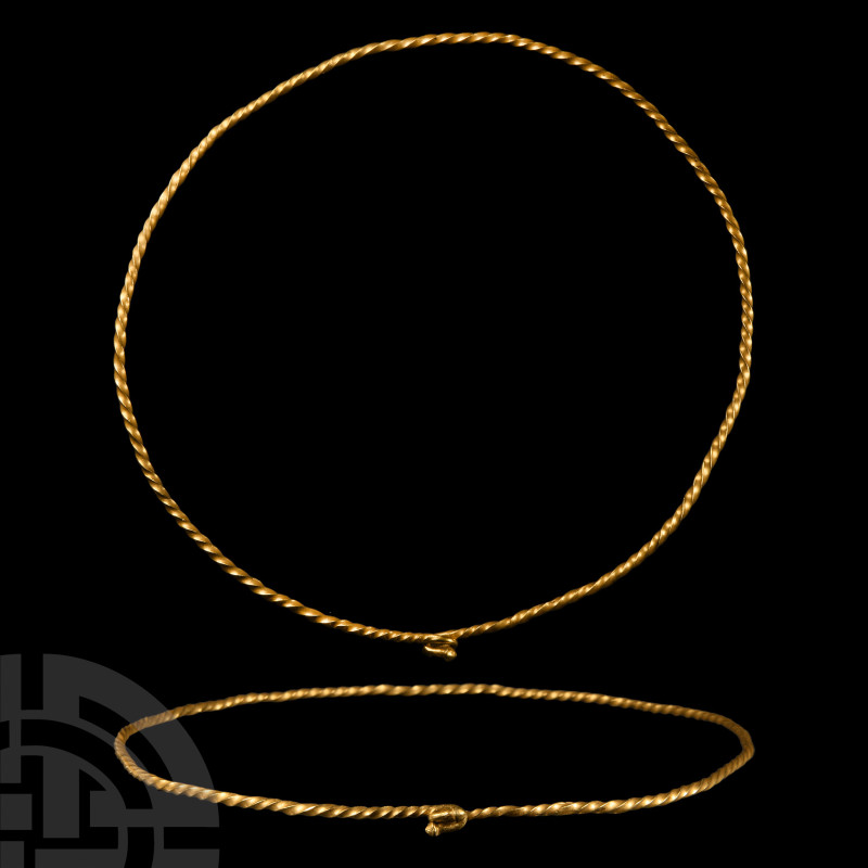 Viking Age Twisted Gold Torc
11th century A.D. Comprising a slender penannular ...
