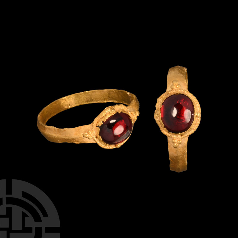 Medieval Gold Ring with Garnet
14th-16th century A.D. Carinated hoop with granu...