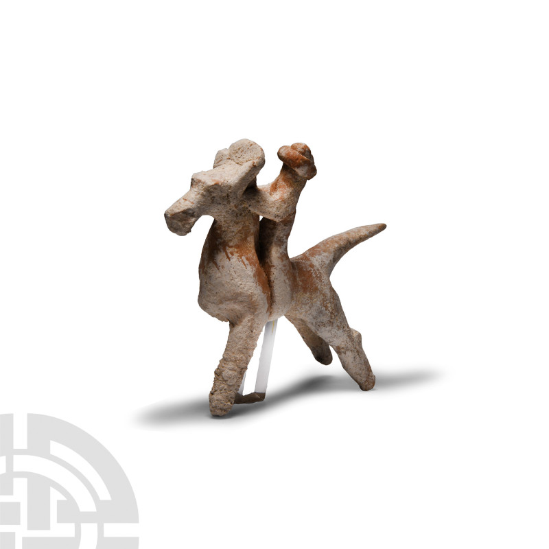 Greek Terracotta Votive Horse and Rider Figure
Circa 700 B.C. Modelled in the r...