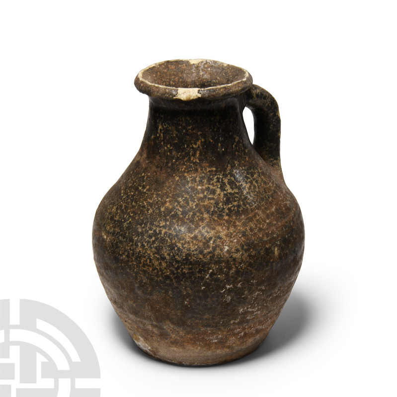 Parthian Glazed Ceramic Jug
1st century B.C.-1st century A.D. Speckled glaze; d...