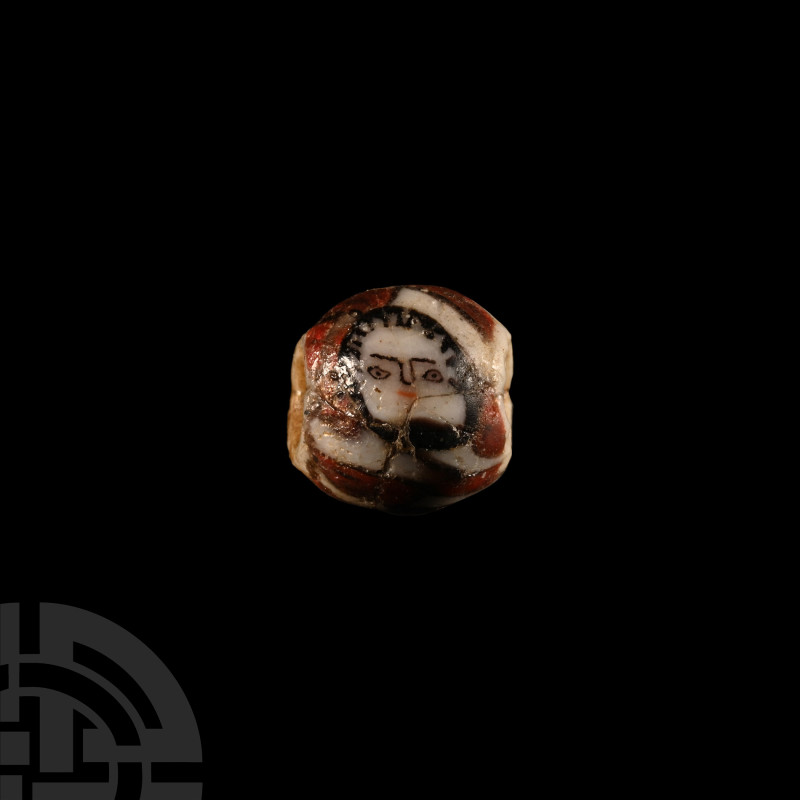 Roman Glass Face Bead
1st century B.C.-1st century A.D. Of roughly spherical fo...