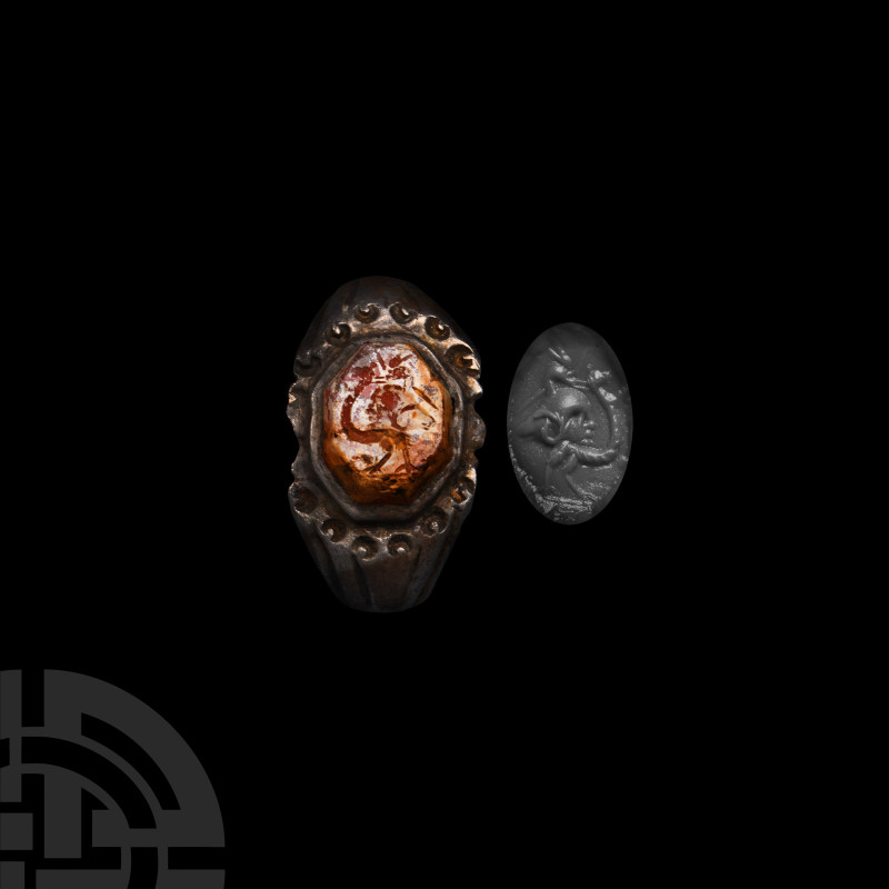 Roman Silver Ring with Gemstone
3rd century A.D. The hoop expanding at the shou...