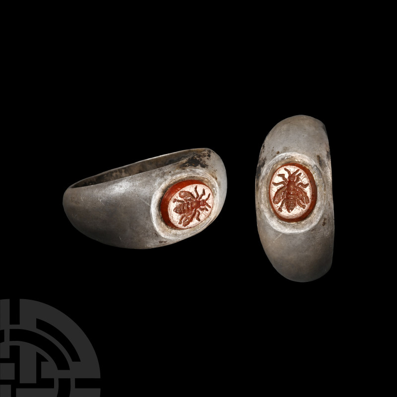 Roman Silver Ring with Bee Gemstone
2nd-3rd century A.D. Broad hoop with inset ...