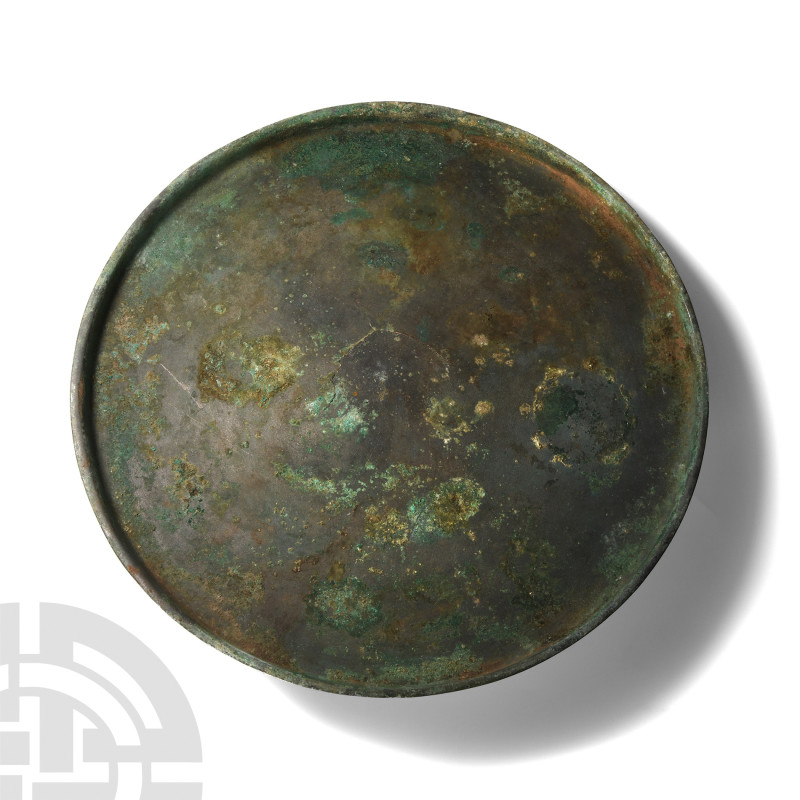 Roman Bronze Footed Platter
Circa 1st-4th century A.D. Comprising a shallow tap...