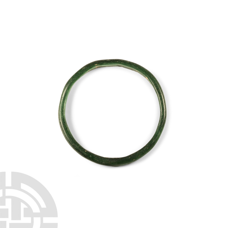 Roman Green Glass Bracelet
3rd-5th century A.D. Composed of an annular hoop wit...
