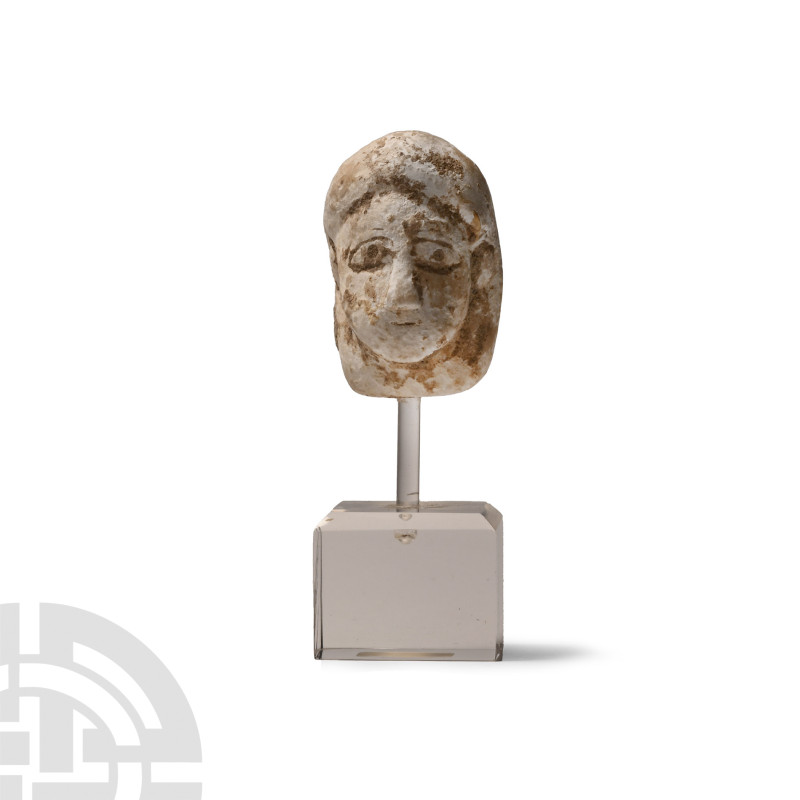 Bactrian Stone Head
1st-2nd century A.D. Modelled with stylised facial features...