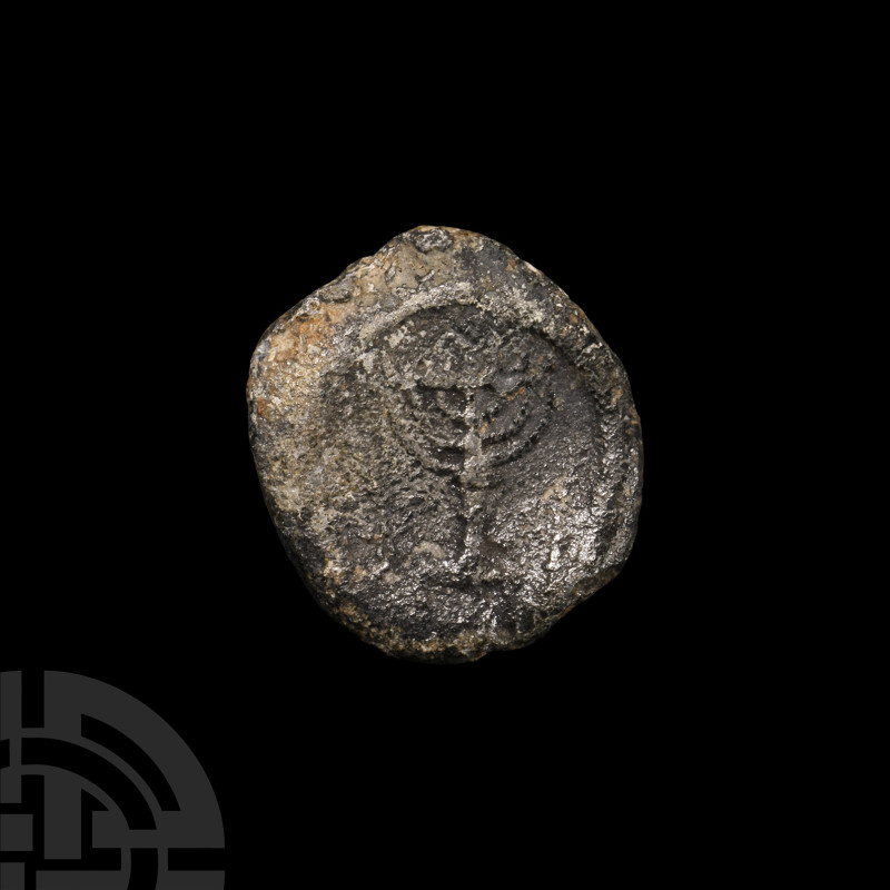 Large Jewish Lead Sealing with Menorah
Circa 2nd century A.D. Displaying a meno...