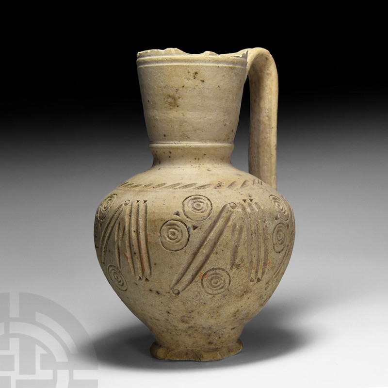 Western Asiatic Decorated Ceramic Ewer
Circa 14th-16th century A.D. The bulbous...