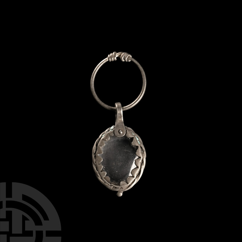 Viking Age Silver Pendant with Crystal Magnifier
9th-11th century A.D. Displayi...
