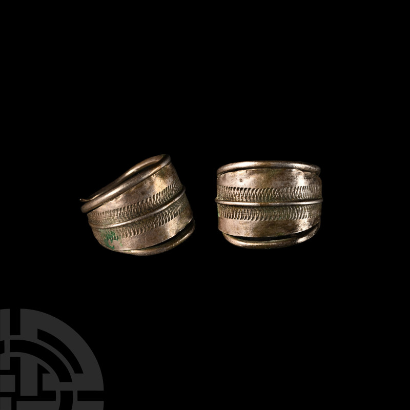 Viking Silver Ring with Engraved Design
9th-12th century A.D. Composed of a coi...