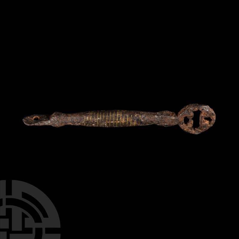 Viking Age Latten Inlaid Iron Key
9th-11th century A.D. Comprising an openwork ...