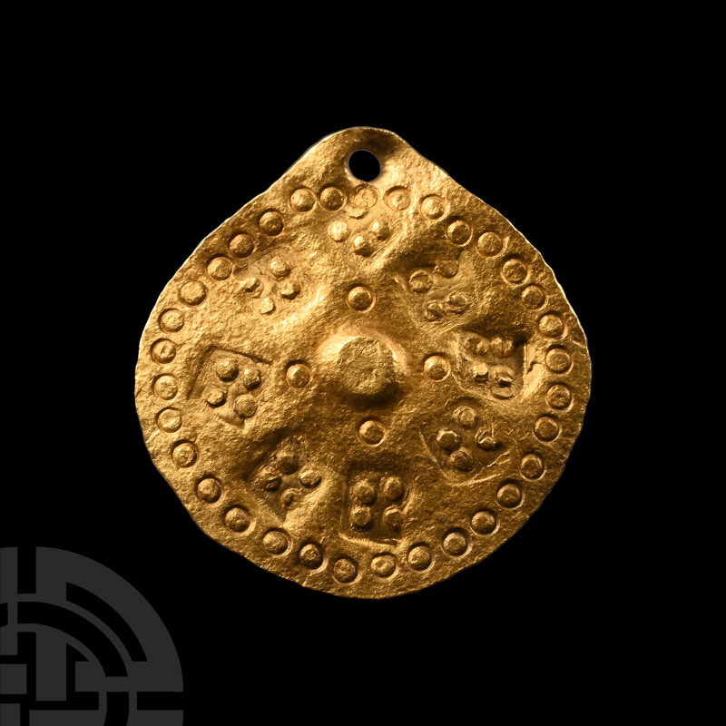 Viking Age Gold Scutiform Pendant
9th-11th century A.D. Composed of a flat-sect...