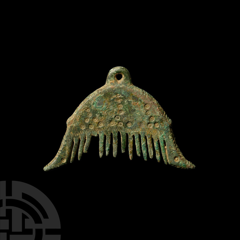 Viking Age Bronze Comb Pendant
9th-11th century A.D. Comprising a roughly semi-...