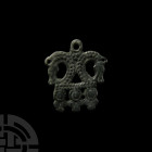 Viking Age Bronze Pendant with Opposed Horse Heads