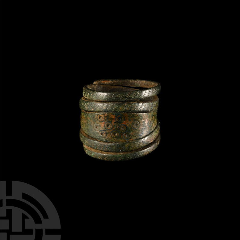 Viking Coiled Bronze Ring
9th-11th century A.D. Punched ring-and-dot decoration...
