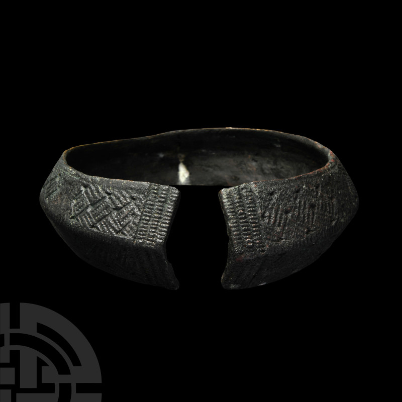 Viking Age Bronze Bracelet with Hatched Panels
9th-11th century A.D. Formed as ...