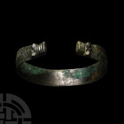 Viking Age Stamped Bronze Bracelet with Beast Head Terminals