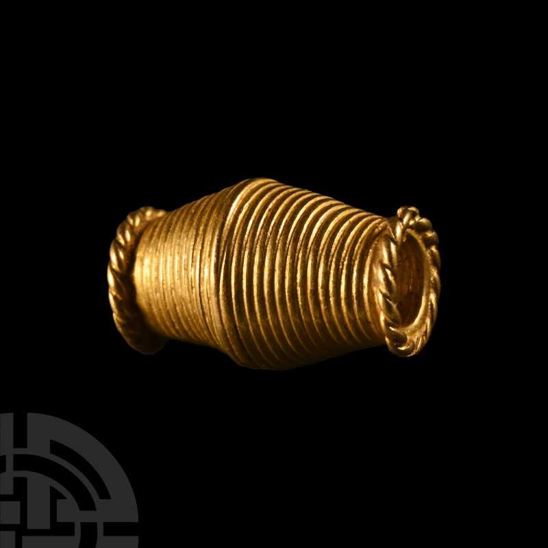 Viking Age Gold Biconical Bead
9th-11th century A.D. Adorned with filigree wire...