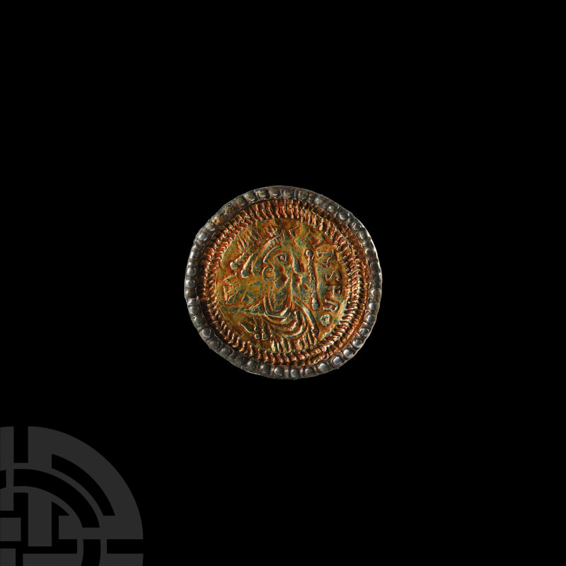 Visigothic Silver-Gilt 'CMASPRO' Nummular Brooch
5th-6th century A.D. Comprisin...
