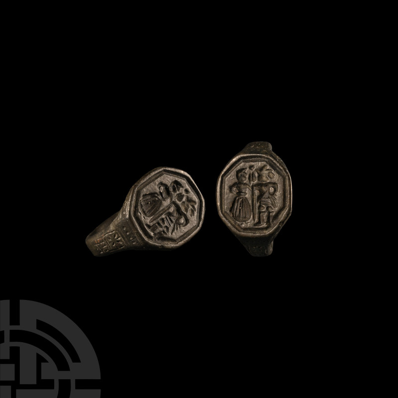 Medieval Bronze Ring with Facing Couple
14th-16th century A.D. Octagonal bezel ...