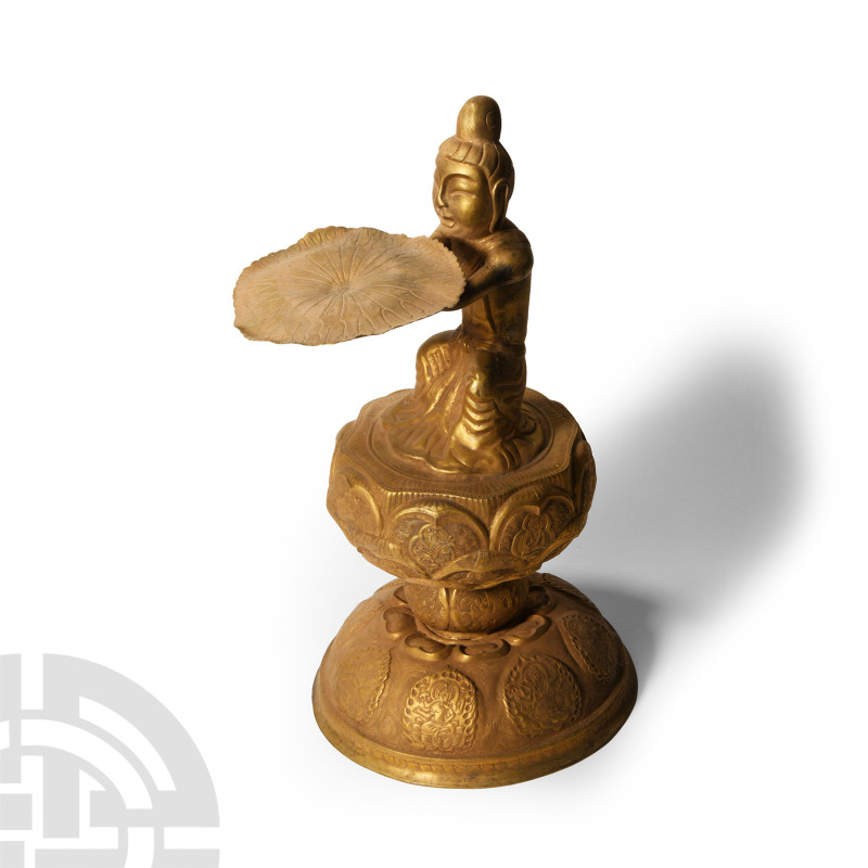 Tang Style Gilt Bronze Figure
20th century A.D. Hollow-formed gilt lotus-shaped...