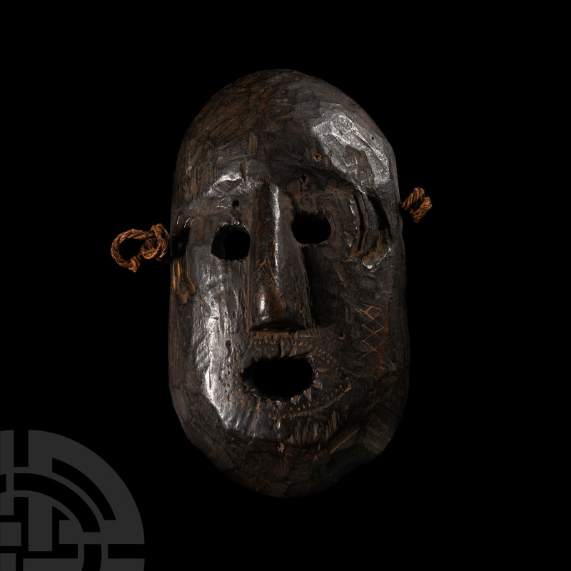 Nepalese Wooden Mask
19th century A.D. Representing a male face with detailing ...