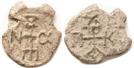 LEAD SEAL, 25x28 mm, c. 700?, Cruciform monogram/ similar, F-VF, very irregular flan, both sides completely clear.