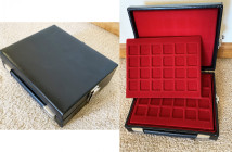 ABAFIL (?) style suitcase, 9-1/2x7-1/2x2.7" black leatherlike with 6 red plush trays each with spaces for 24 coins; metal clasps. Excellent condition.