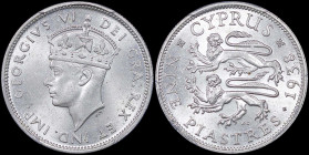 CYPRUS: 9 Piastres (1938) in silver (0,925). Crowned head of King George VI facing left on obverse. Two stylized rampant lions, date at right, denomin...