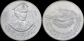 LIBYA: Commemorative non-denominated coin (1979) in silver for the 10th Anniversary of Colonel Qaddafi as President. Bust of Colonel Caddafi facing 3/...