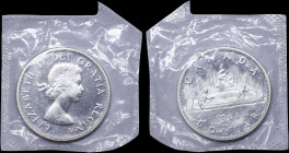 CANADA: 1 Dollar (1963) in silver (0,800). Laureate bust of Queen Elizabeth II facing right on obverse. Voyager, date and denomination below on revers...