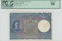 CEYLON: 10 Rupees (7.5.1946) in blue and multicolor. Portrait of King George VI at left on face. S/N: "J/41 091417". WMK: Chinze. Inside holder by PCG...