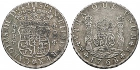 Carlos III (1759-1788). 8 reales. 1768. Potosí. JR. (Cal-967). Ag. 26,58 g. Roseta de 6 pétalos. Punto entre la corona y los mundos. Escasa. MBC. Est....