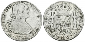 Carlos IV (1788-1808). 8 reales. 1791. México. FM. (Cal-681). Ag. 26,61 g. Pequeños resellos orientales. BC+. Est...40,00.