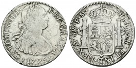 Carlos IV (1788-1808). 8 reales. 1795. México. FM. (Cal-689). Ag. 26,75 g. Golpecito en el canto. BC+. Est...40,00.