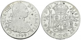 Carlos IV (1788-1808). 8 reales. 1799. México. FM. (Cal-694). Ag. 26,78 g. Pequeños resellos orientales. BC+. Est...35,00.