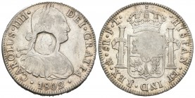 Carlos IV (1788-1808). 8 reales. 1802. México. FT. (S-3766). (Km-656). (De Mey-660). Ag. 26,89 g. Resello octogonal con el busto de George III realiza...
