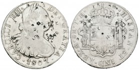 Carlos IV (1788-1808). 8 reales. 1807. México. TH. (Cal-707). Ag. 26,76 g. Resellos orientales. BC+. Est...60,00.