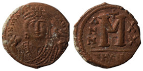 Maurice Tiberius, 582-602. Follis (bronze, 9.40 g, 27 mm), Theoupolis (Antioch). d N MAVRI C N P AVT Crowned bust of Maurice facing, wearing consular ...