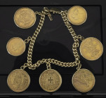 Miscellaneous - Coins in jewellery - Gold bracelet with 7 coins: Netherlands 5 Gulden 1912 & 10 Gulden 1875, England ½ Pound 1874, USA $5 1909-D, Swit...