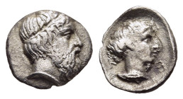 THESSALY. Kierion (circa 400-344 BC). Hemiobol.

Obv: Head of Zeus to right, wearing tainia. 
Rev: K-I-E 
Head of the nymph Arne to right; all within ...