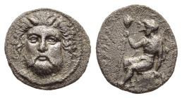 THESSALY. Metropolis (circa 400-350 BC). Obol.

Obv: Facing head of horned and bearded river god. 
Rev: MHTPOΠO Dionysos, bearded and in full robes, s...