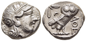 ATTICA. Athens. Tetradrachm (circa 353-294 BC).

Obv: Helmeted head of Athena right, with profile eye.
Rev: AΘE.
Owl standing right, head facing; oliv...