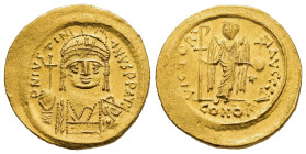 JUSTINIAN I (527-565). Gold Solidus. Constantinople.

Obv: D N IVSTINIANVS P P AVG.
Helmeted and cuirassed bust facing, holding globus cruciger and sh...