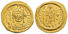 JUSTINIAN I (527-565). Gold Solidus. Constantinople.

Obv: D N IVSTINIANVS P P AVG.
Helmeted and cuirassed bust facing, holding globus cruciger and sh...