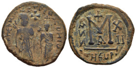 SASANIAN KINGS. Khosrau II, 591-628. Follis.

Obv: dd NN hERACLIuS Et hERA CONST PP A 
Heraclius and Heraclius Constantine standing facing, each crown...