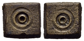 ISLAMIC WEIGHTS (circa 10-13th centuries). Commercial weight of 1 Dirham or 1/5 Uqiya. Bronze.

A square shaped Seljuk or Beylik coin weight; concentr...